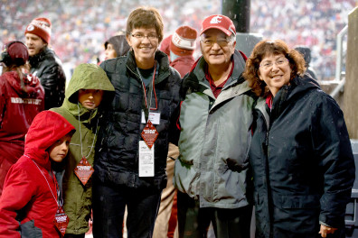Washington State University co-Provosts Erica Austin and Ron Mittelhammer honor sociology professor Julie Kmec during a third quarter timeout of the Cougars game against the Stanford Cardinal on Saturday, Oct. 31, 2015, at Martin Stadium in Pullman.